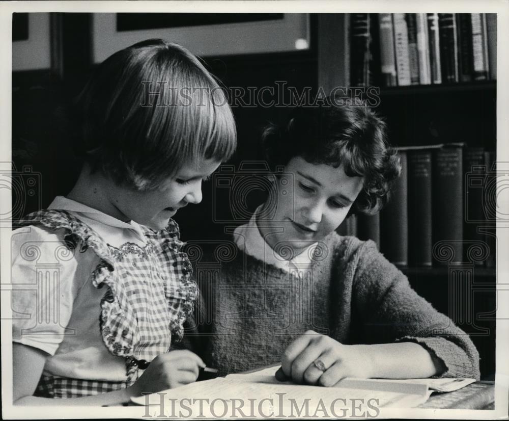 1960 Press Photo Paul Pace helps girl Penny with homework - nee88037 - Historic Images