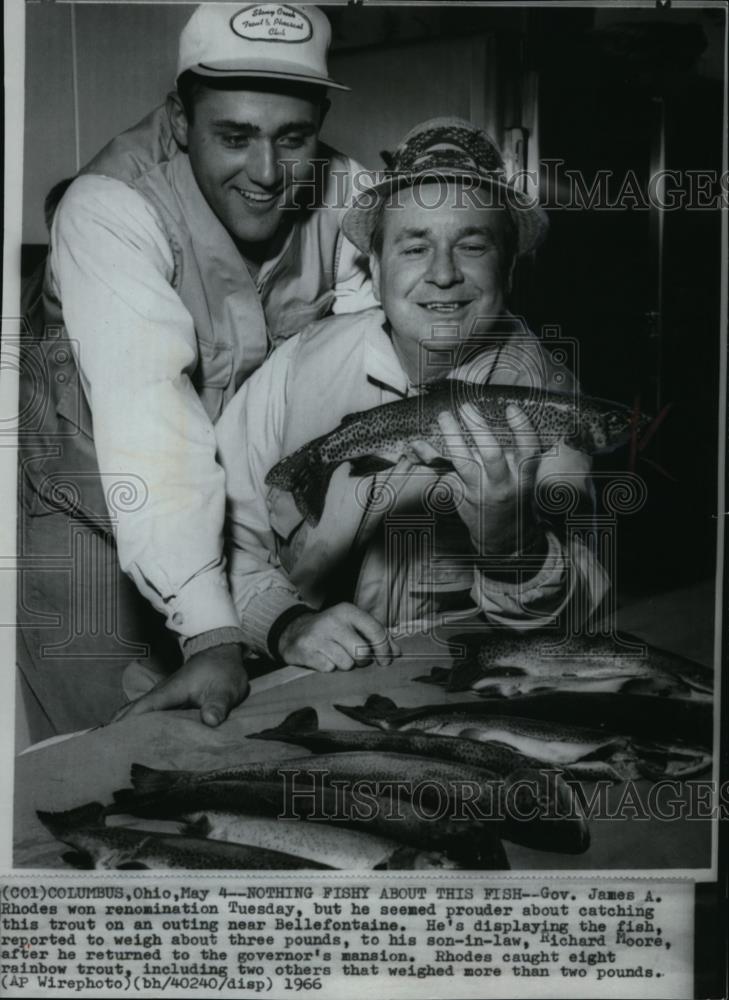 1966 Wire Photo Gov. Rhodes is proud catching trout in outing at Bellefontaine - Historic Images