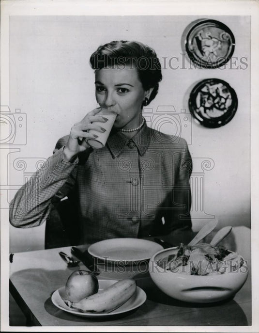 1954 Press Photo A woman at a kitchen table eating a meal - nee87424 - Historic Images