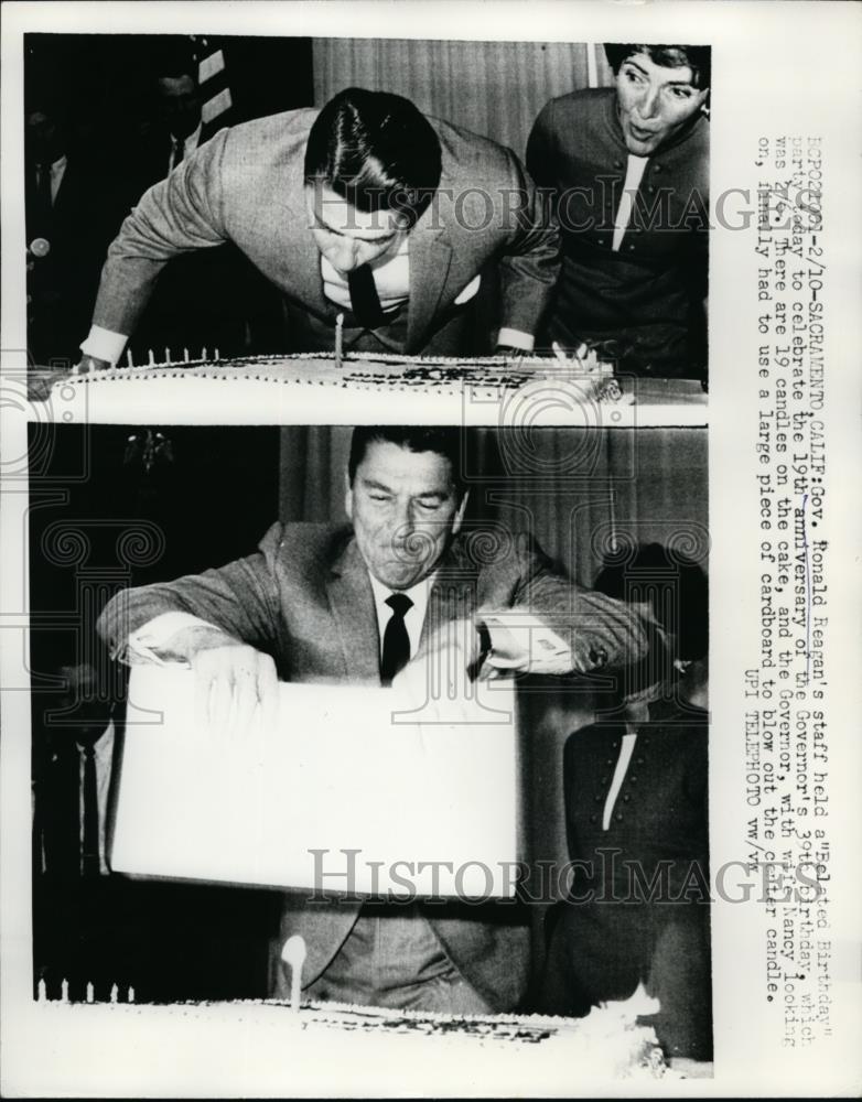 1969 Press Photo Gov. Ronald Reagan celebrates his 39th Birthday blow his cake - Historic Images