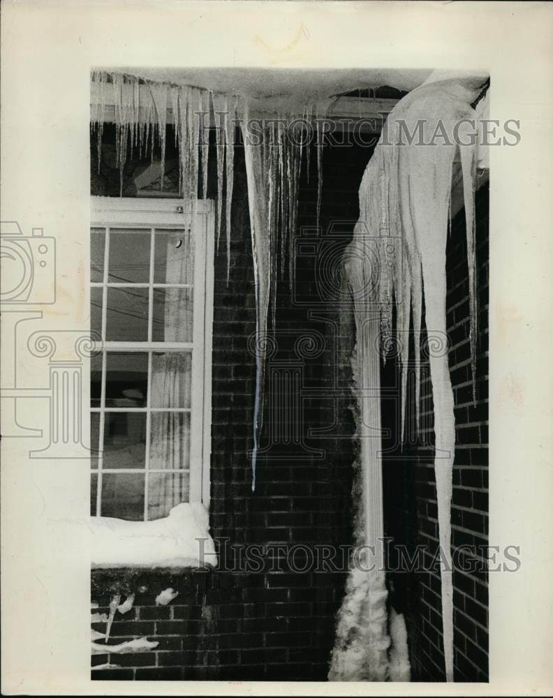 1953 Press Photo Icicles hang from a Cleveland Ohio homes roof - nee87786 - Historic Images