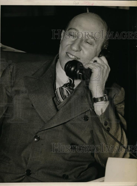 1939 Press Photo Mr Fishman on phone at his desk in his office - nee87690 - Historic Images