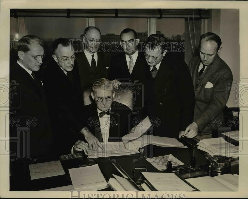 1941 Press Photo William Knudsen, Director of OPM gets Industrial Plant Report. - Historic Images