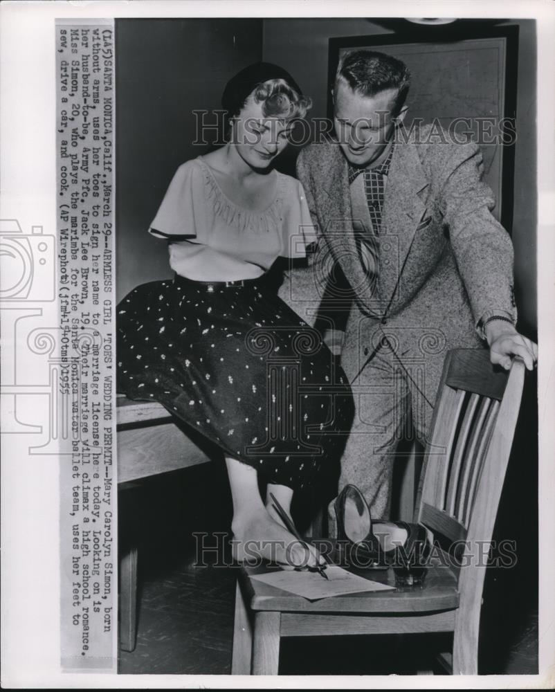 1956 Wire Photo Mary Carolyn Simon born withou arm used toes to sign her name. - Historic Images