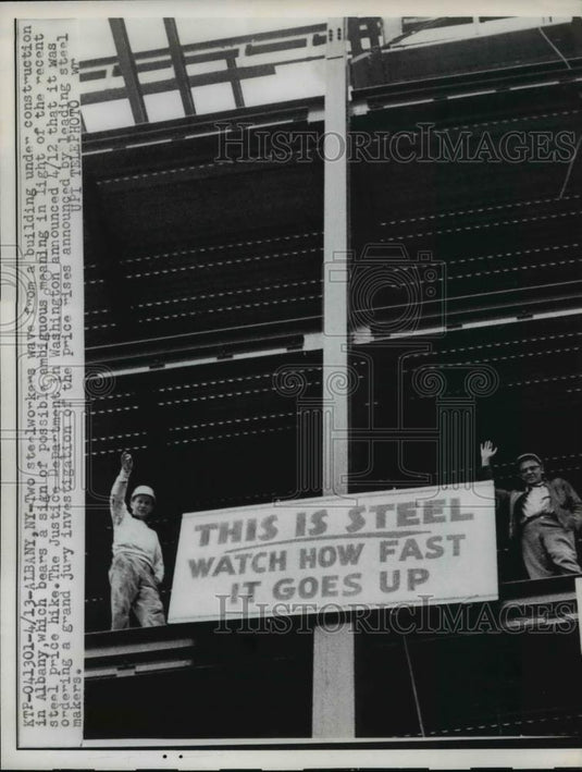 1962 Press Photo Steel Worker wave from Bldg.in Albany with a sign of Price hike - Historic Images