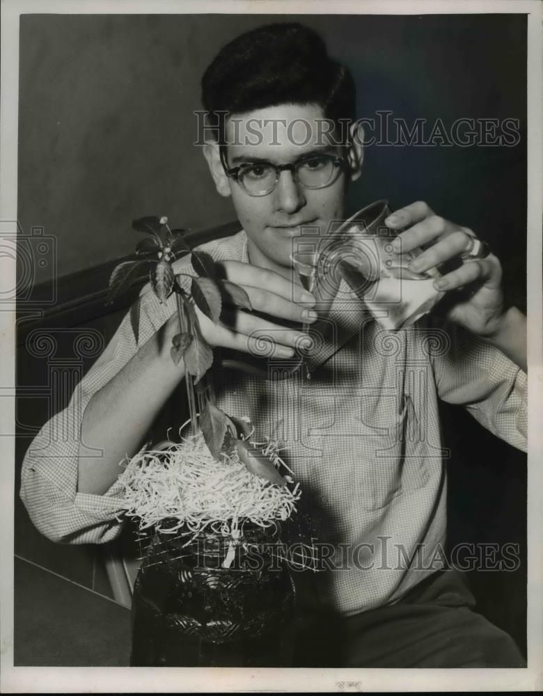 1955 Press Photo Dan Deutschman Watering The Plant - nee85855 - Historic Images