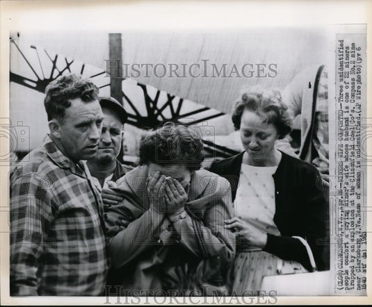 1963 Wire Photo Miner's wife comforted by three people in the mine site - Historic Images