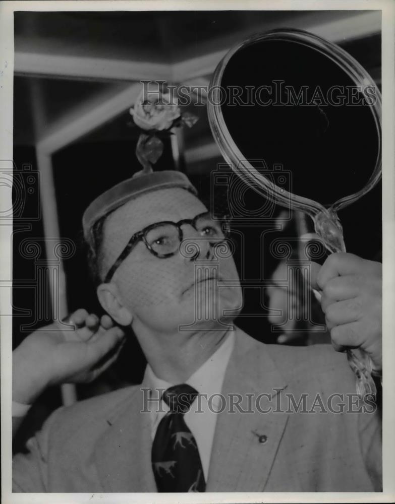 1954 Press Photo An Easter bonnet for 1954 fashions tried on by a man - Historic Images