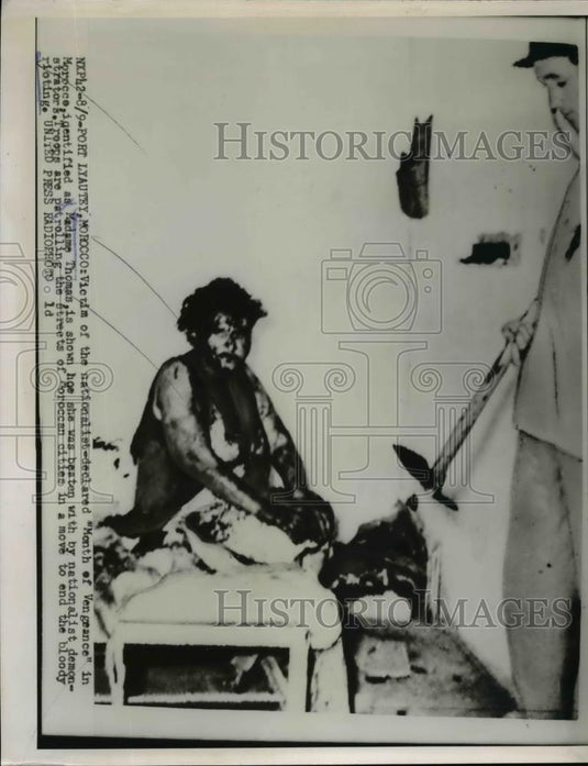 1954 Press Photo Madame Thomas As She Was Beaten By Nationalist Demonstrators - Historic Images