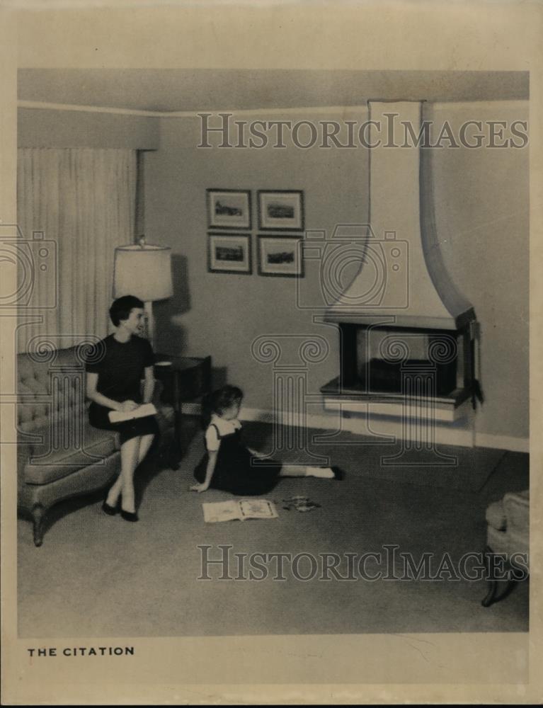 1960 Press Photo A woman &amp; daughter sit by their homes livingroom fireplace - Historic Images