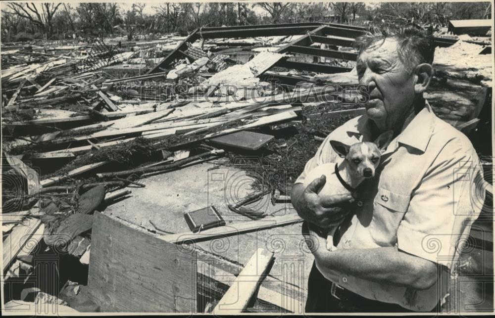 1969 Wire Photo Earl B Mathews amidst rubble of his apt after Hurricane Camille - Historic Images