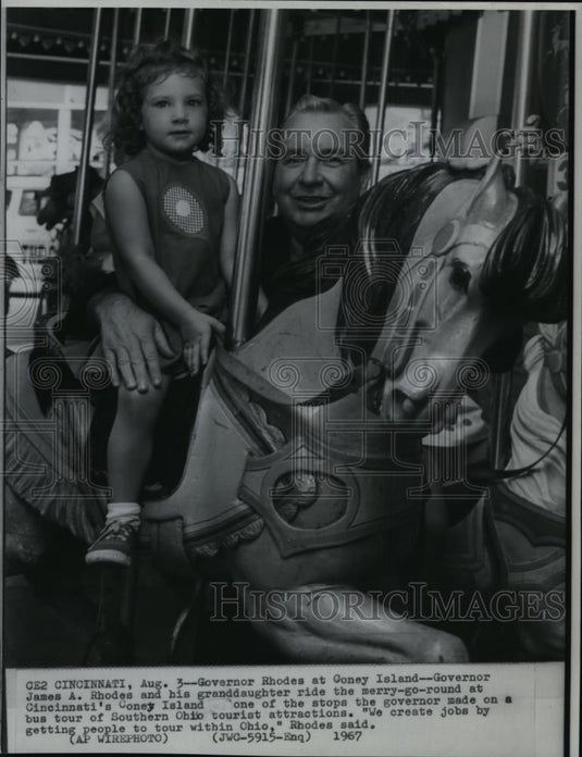 1967 Wire Photo Gov James Rhodes & granddaughter at merry-go-round - cvw10960 - Historic Images