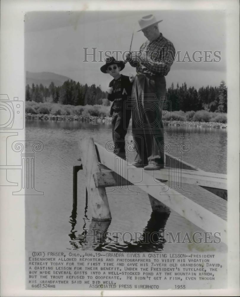 1955 Wire Photo Pres. Eisenhower gives a casting lesson to Dave during vacation - Historic Images