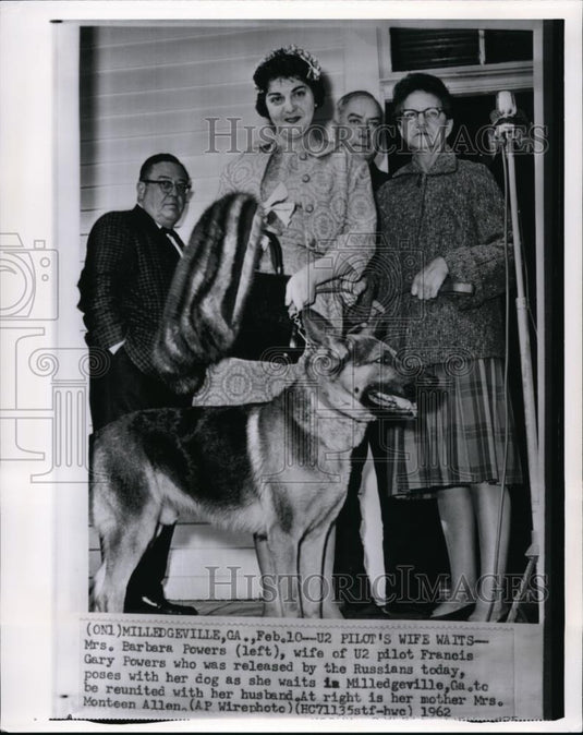 1962 Wire Photo Mrs. Barbara Powersposes with her dog as she waits  - cvw11402 - Historic Images