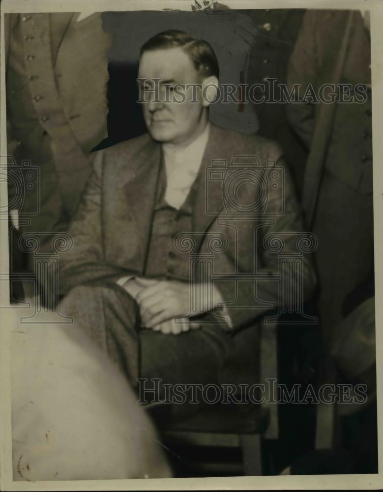 1934 Press Photo Bernard O Hallas relaxes in a chair at an office - nee85985 - Historic Images