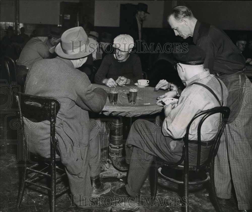 1951 Press Photo Patrons are being served by waiter as they play cards. - Historic Images