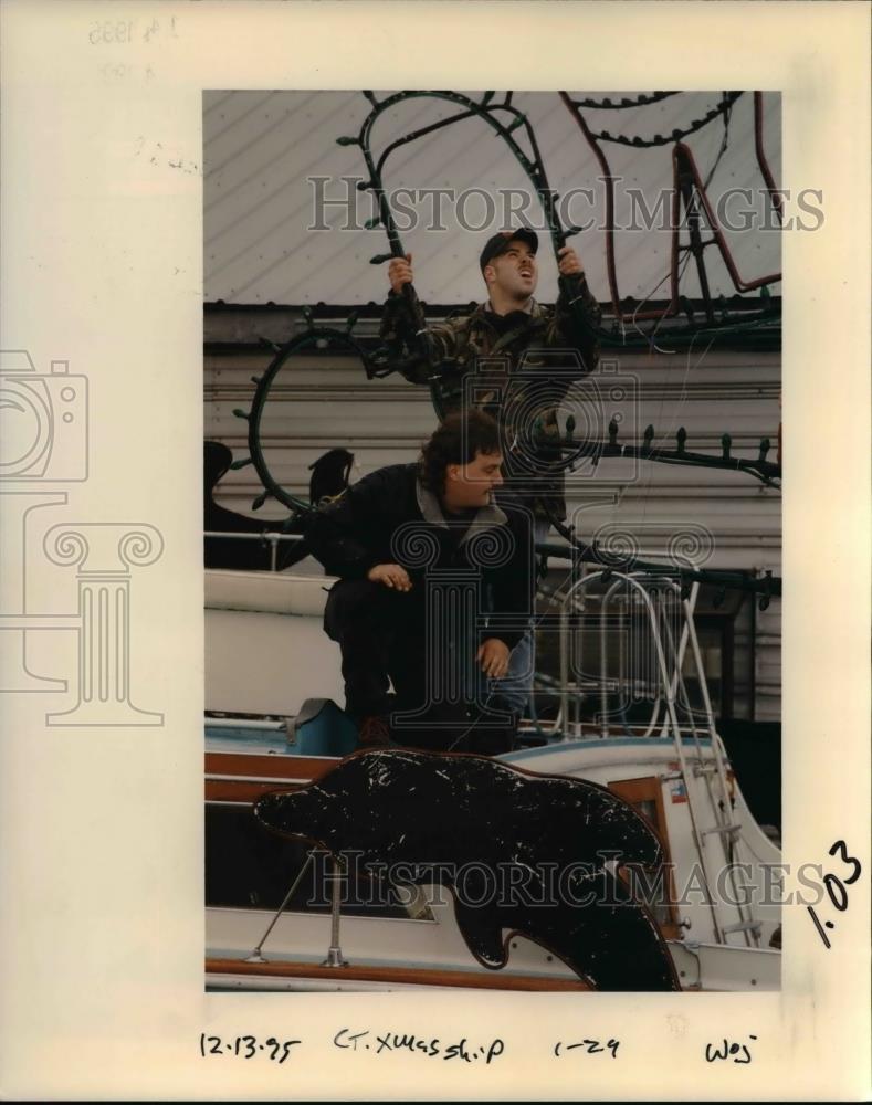 1995 Press Photo Men decorating one of the Christmas ships - orb10621 - Historic Images