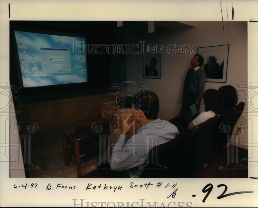 1997 Press Photo Individuals listening about focus systems discussion - orb19042 - Historic Images