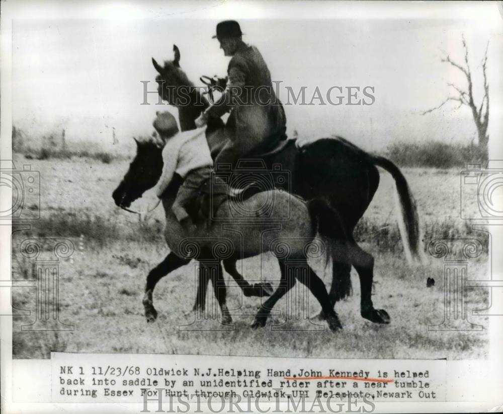 1968 Press Photo John Kennedy Helped By The Rider Back Into The Saddle - Historic Images