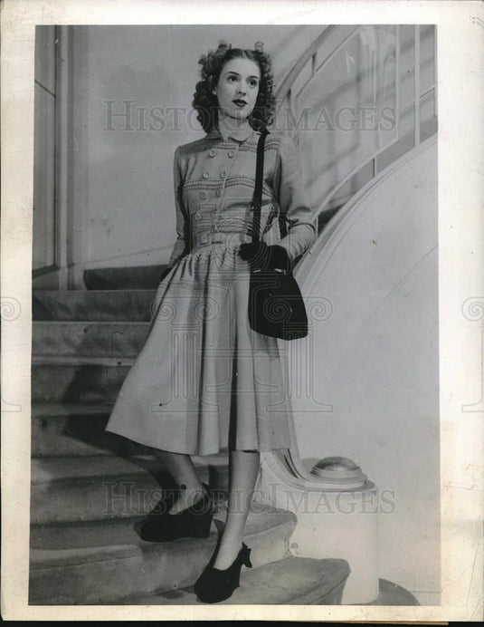 1944 Press Photo Young Parisian wears frock of simple blue wool - neb69710 - Historic Images
