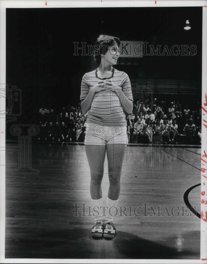 1976 Press Photo Nicki Gambitta stuffs waistband with pom poms during a can can - Historic Images
