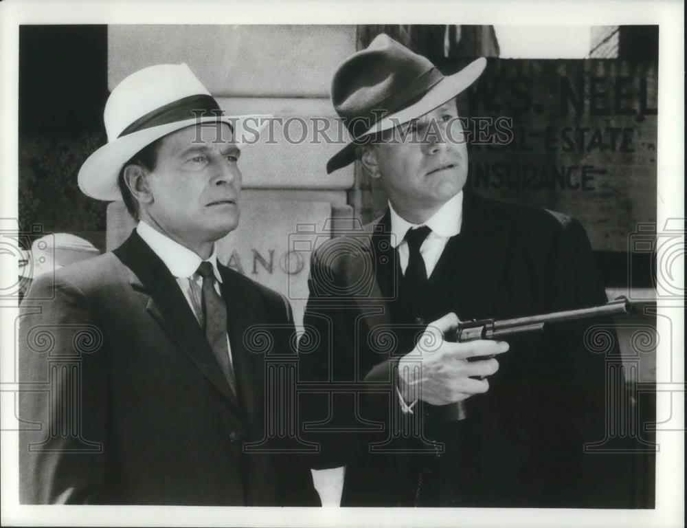 Press Photo Two Men One with Gun - cvp10011 - Historic Images