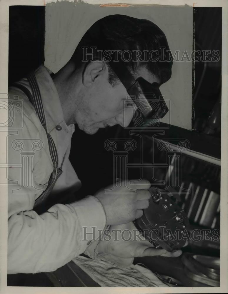 1947 Press Photo Godfrey Di Renzo repairs parking meter - nee93138 - Historic Images