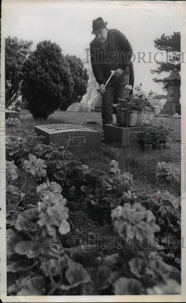 1968 Press Photo Fred Rader trims high grass of grandparents graves - nee93137 - Historic Images