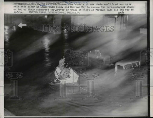 1959 Press Photo Firemen use shovels to row boat across flooded Lankershim Blvd - Historic Images