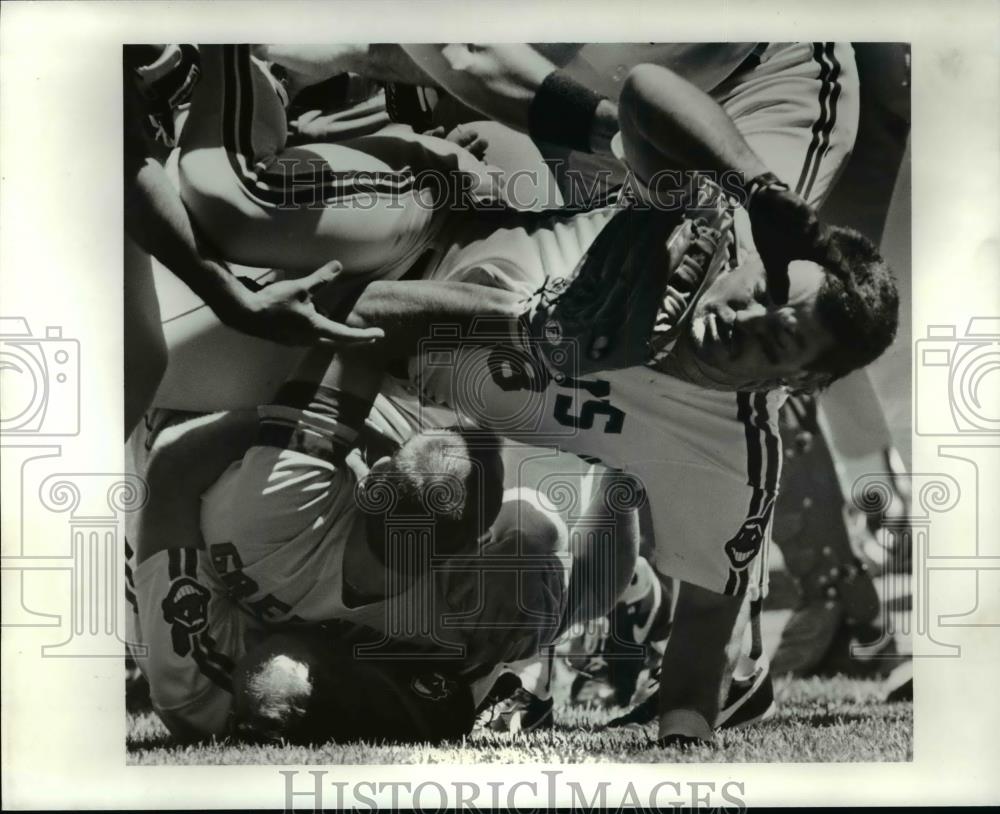 1990 Press Photo Chris James falls over a fallen Mike Greenwell - cvb57744 - Historic Images