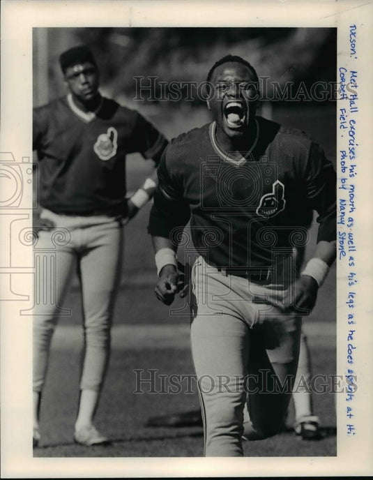 Press Photo Met Hall, exercises mouth and legs at Hi Corbett field. - Historic Images