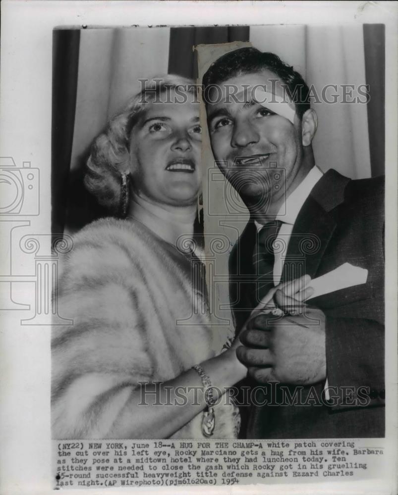 1954 Press Photo Boxer Rocky Marciano gets a hug from his wife Barbara - Historic Images