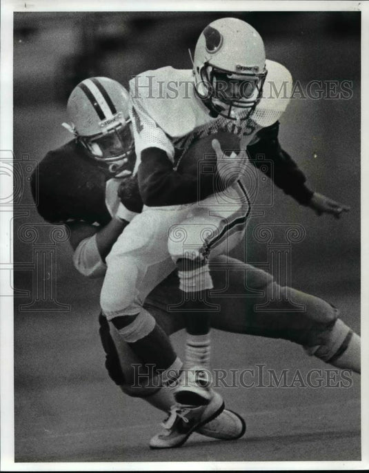 1986 Press Photo St. Joseph QB Dale Pratt is sacked by St. Ed's Bob Lenart - Historic Images