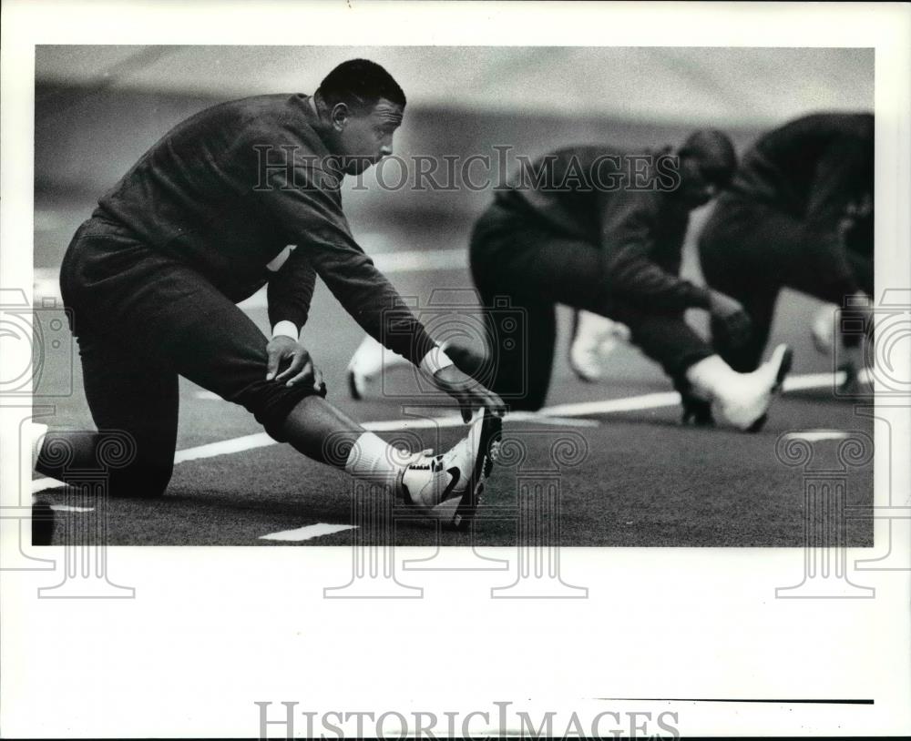 1991 Press Photo: Lawyer Tillman stretches at the Browns mini camp  - cvb58711 - Historic Images