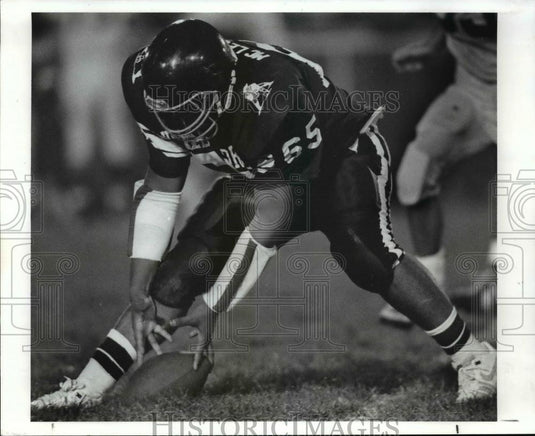 1989 Press Photo Phil McLester Picks Up a Fumble by Najeh Salti  - cvb63913 - Historic Images