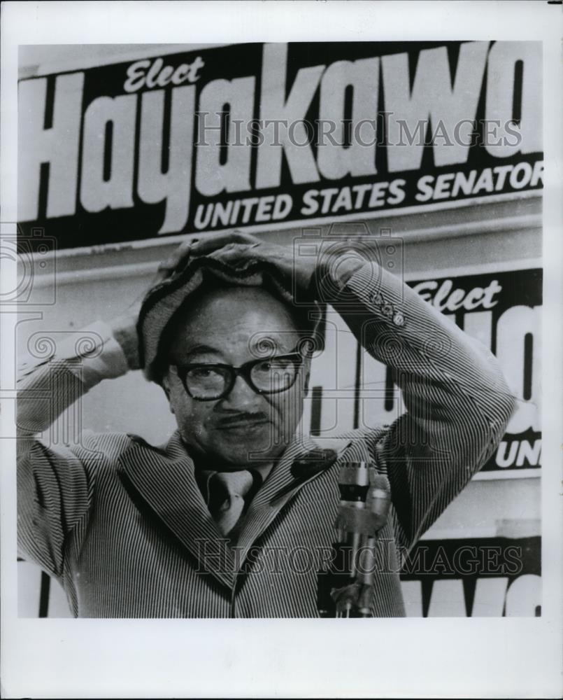 Press Photo Senate Candidate Heyakawa poses in front of election posters - Historic Images