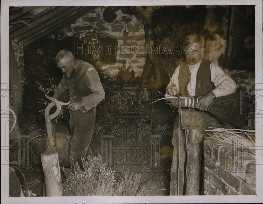 1928 Press Photo Mr Holiday &amp; his son make heather blooms - nee94417 - Historic Images