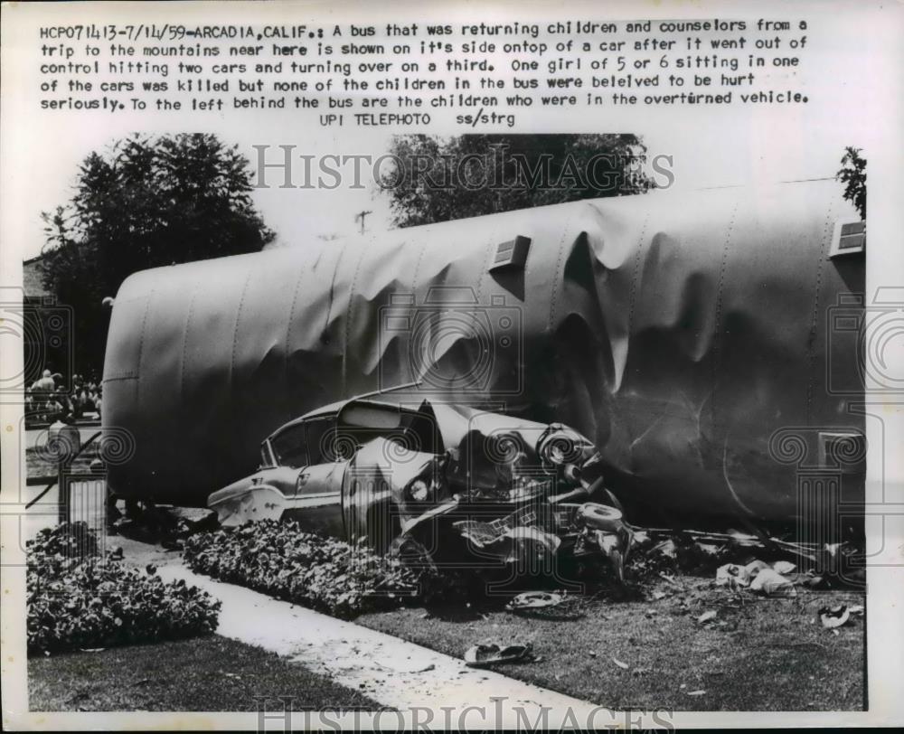 1959 Press Photo Bus ontop of car after it went out of control at Arcadia Calif - Historic Images