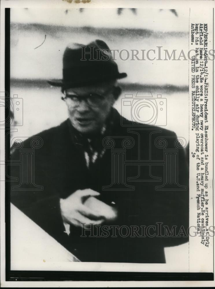 1957 Press Photo President Eisenhower bundled up as he arrives at Orly Airfield - Historic Images