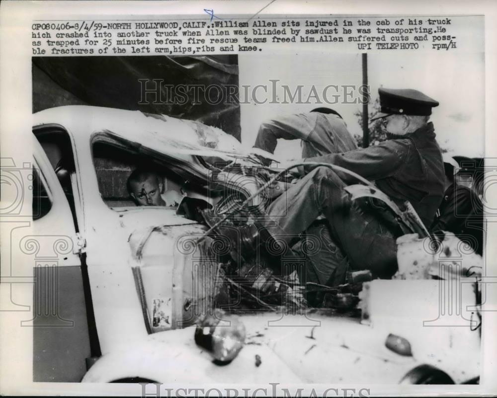 1959 Press Photo William Allen sits injured in cab of his truck after crash - Historic Images