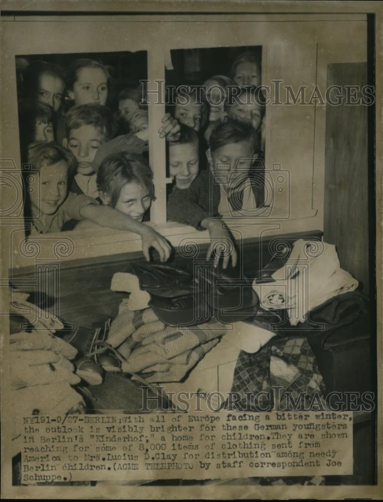 Press Photo German Orpans Reaching For Donated Clothes - nef00993 - Historic Images