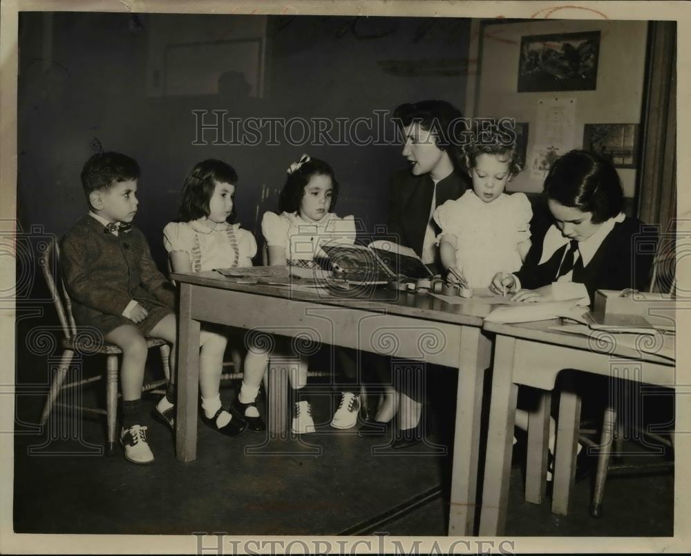 1949 Press Photo Mrs Marvin Kronenberg cares for children in new nursery - Historic Images