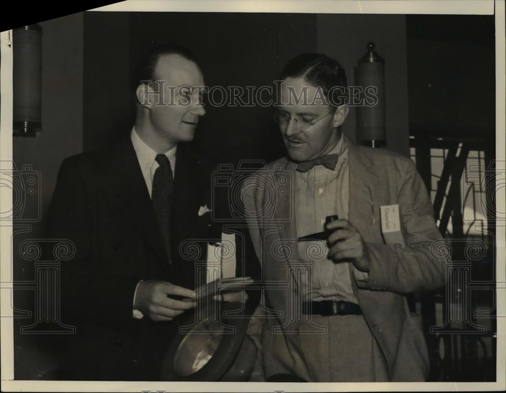 1937 Press Photo Allan Dulles &amp; Roger Cortesi talk in airport terminal - Historic Images