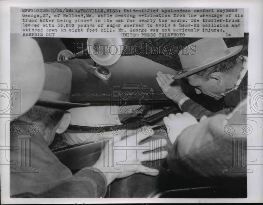 1958 Press Photo Bystanders comfort Raymond George after he became trapped - Historic Images