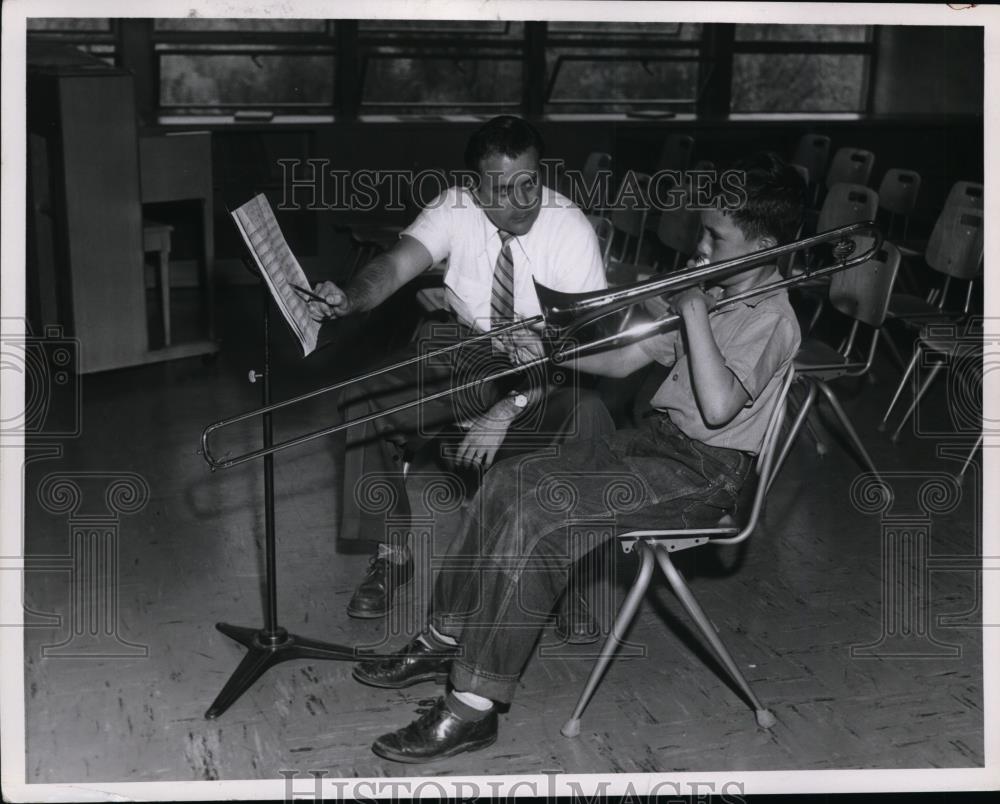 1957 Press Photo Music teacher John Millard instructs Kenneth Harbert - Historic Images