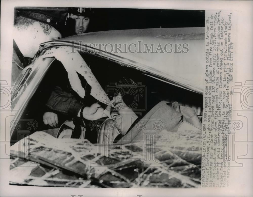 1962 Press Photo Arthur St Peter injured when ladder from fire truck fell - Historic Images