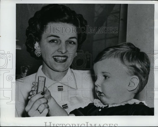 1950 Press Photo Mrs. Shaw And Son Holding A Whistle - nee94771 - Historic Images