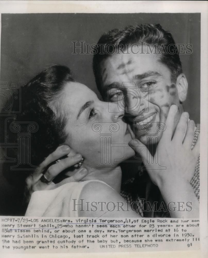 1954 Press Photo Virginia Torgerson kisses son who she has not seen in 23 years - Historic Images