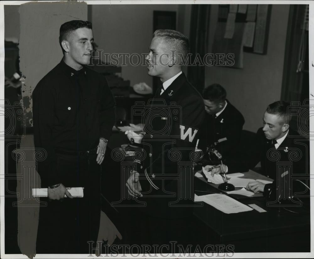 1952 Press Photo Tom Fonestal (L) checks with duty officer, Midshipmen Clarence - Historic Images