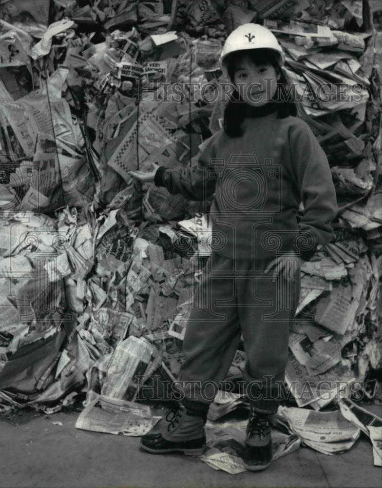 Press Photo Piles of newspaper tower over 13 year old Stephanie Yu  - cvb67730 - Historic Images
